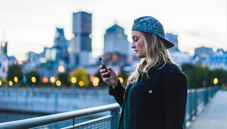 Young woman holding phone