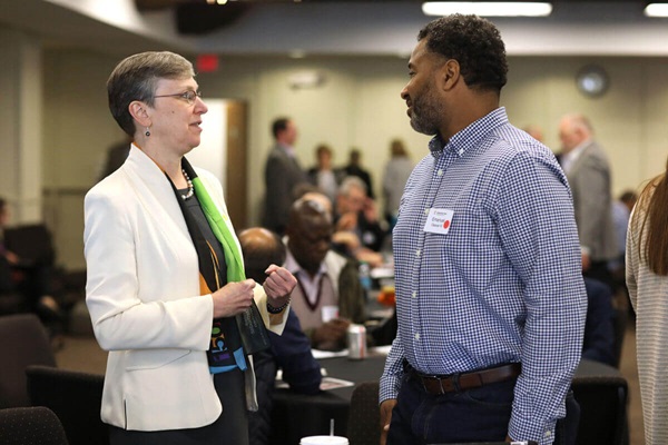 Harriet Olsen talks with the Rev. Emmanuel Clever III during the Connectional Table meeting held at United Methodist Discipleship Ministries in Nashville, Tenn., April 2. Photo by Kathleen Barry, UM News Harriet Olsen talks with the Rev. Emmanuel Clever III during the Connectional Table meeting held at United Methodist Discipleship Ministries in Nashville, Tenn., April 2. Photo by Kathleen Barry, UM News
