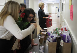 Elizabeth Bradford (right) literally smells the fair-trade coffee held by her aunt Kelly Hall at Trenholm United Methodist Church in Columbia, S.C. The church uses proceeds from the coffee sales for its mission trips to El Salvador.