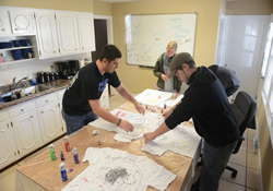 Bonner Scholars at Lindsey Wilson College decorated T-shirts for survivors of child abuse to wear as examination gowns during their 2013 