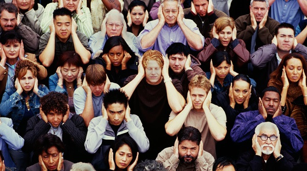 crowd-with-hands-over-ears-ignore-istockphoto-IPGGutenbergUKLtd