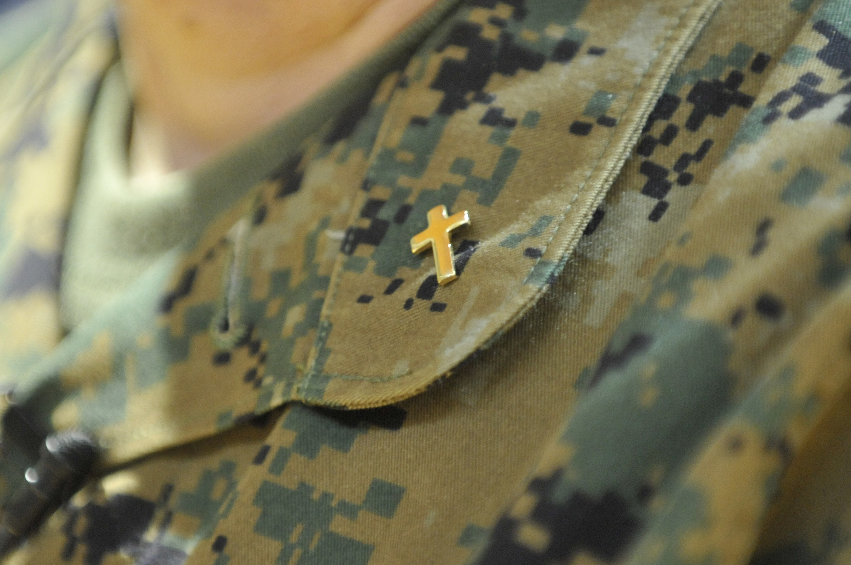 A cross pin reflects Cmdr. Laura Bender’s service to the military. Photo by Jay Malin, UMNS