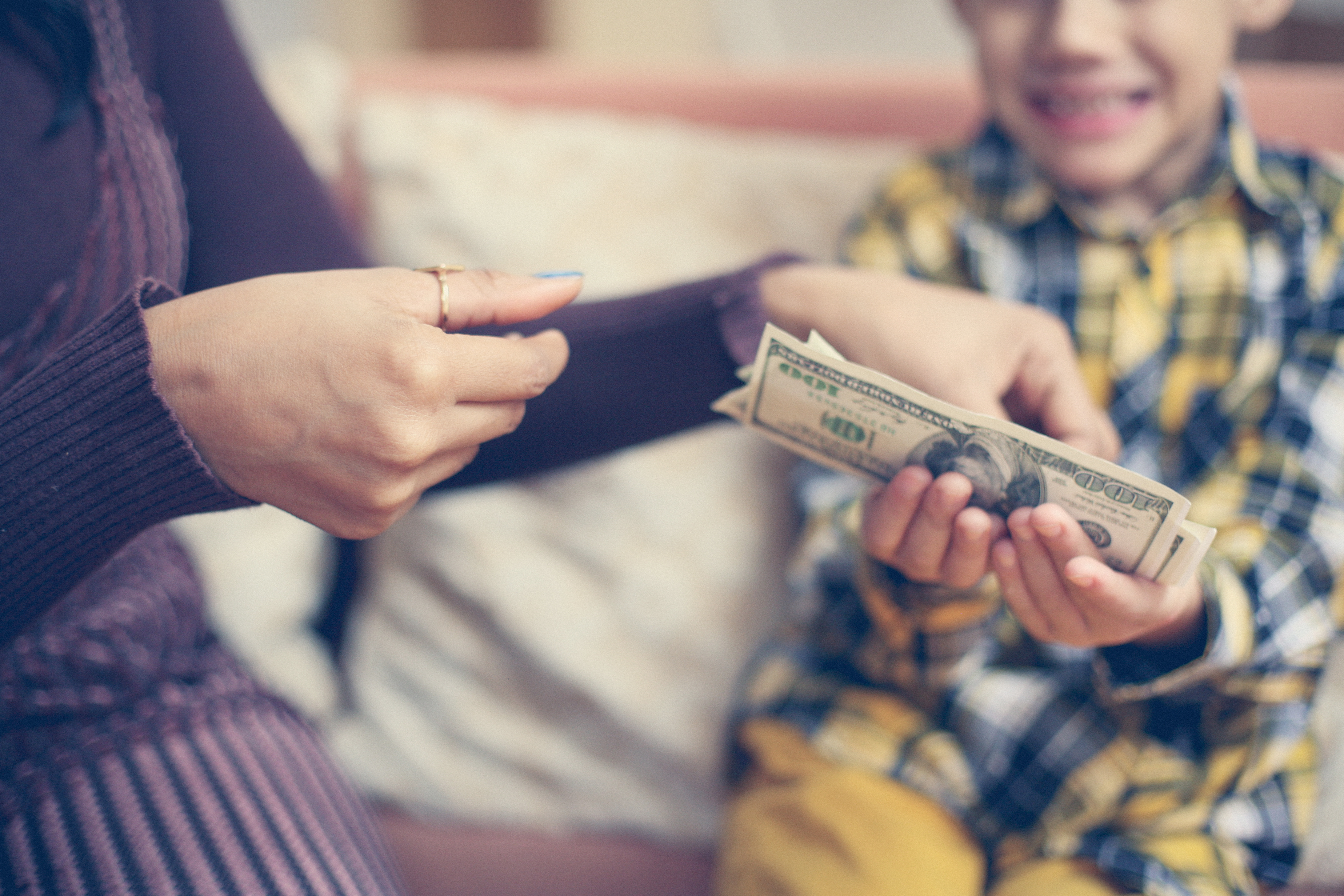 Mother teaches child about money and stewardship. Image © Liderina, iStockPhoto.com. 