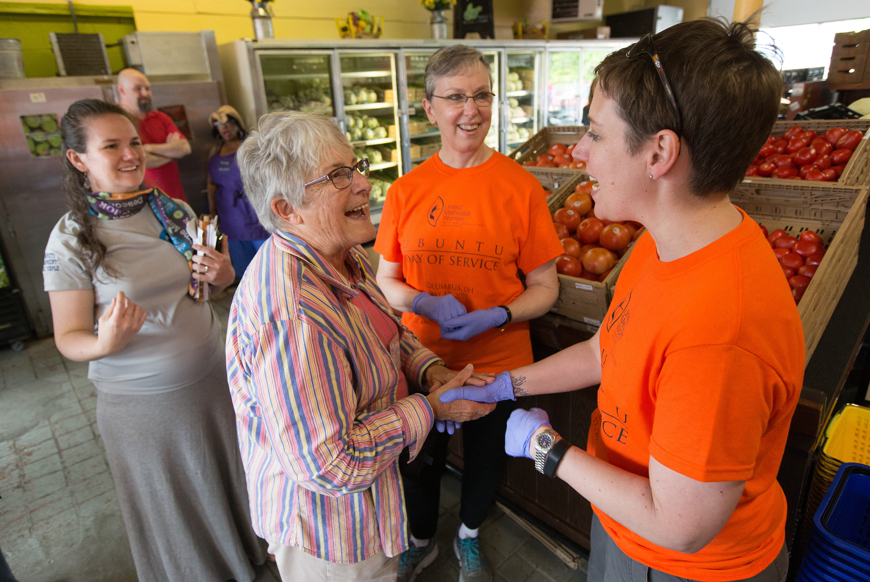 Shannon Priddy (right), the national president of United Methodist Women, and Harriett Jane Olson (center), the organization's chief executive officer, visit with Linda Miller at the All People's Fresh Market in Columbus, Ohio, during the Ubuntu Day of Service, part of the United Methodist Women Assembly 2018 in May. File photo by Mike DuBose, UMNS.
