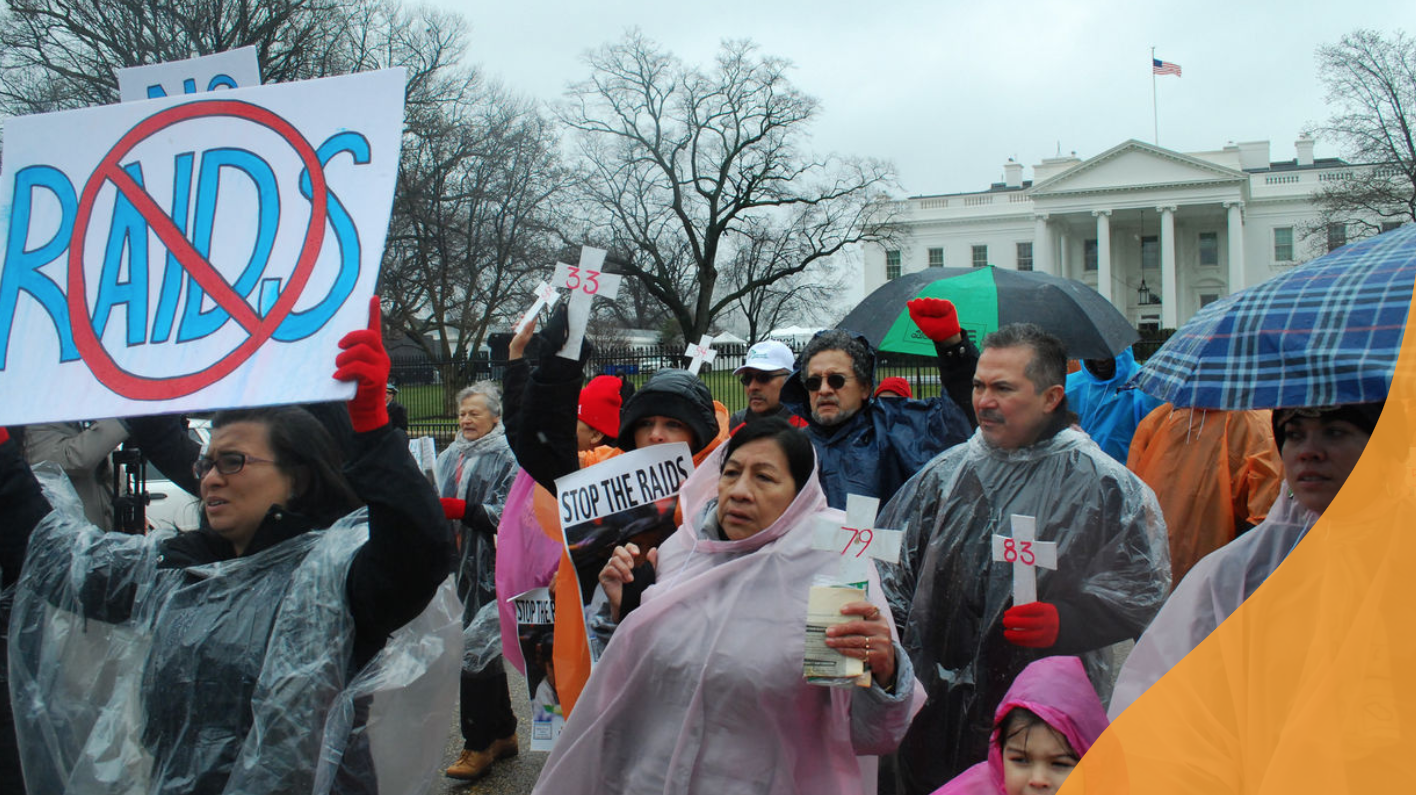 group rally with No Raid signs 