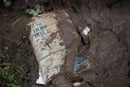 Photo by Mike DuBose, UMNS  A Bible coated in mud lays outside Fenwick (W. Va.) United Methodist Church following heavy flooding. Photo by Mike DuBose, UMNS