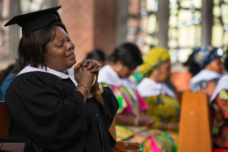 Choir member Juliana Amoah prays during worship at Calvary United Methodist Church, a Ghanaian congregation in Hamburg, Germany. Photo by Mike DuBose, UMNS.