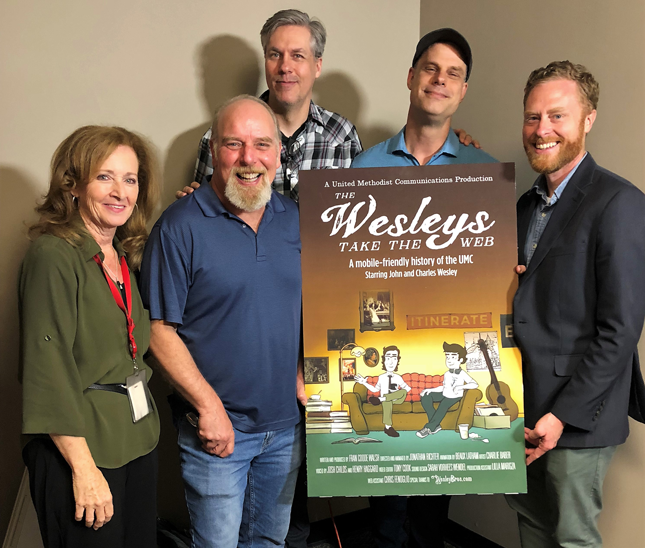The team that created "The Wesleys Take the Web" gathered at United Methodist Communications in June 2018. Front row (left to right): Fran Coode Walsh, script writer and producer; Henry Haggard, voice of John Wesley; the Rev. Charlie Baber, creator of the WesleyBros.com characters. Back row (left to right): Josh Childs, voice of Charles Wesley; Jonathan Richter, animator.