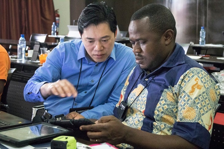 Danny Mai, chief technology officer with United Methodist Communications gives iPad instruction to Pierre Omadjela Tangomo during the Congo Central Conference communicator training held in Ndola, Zambia from Nov. 12-17, 2017. Photo by Kathleen Barry, UMNS.