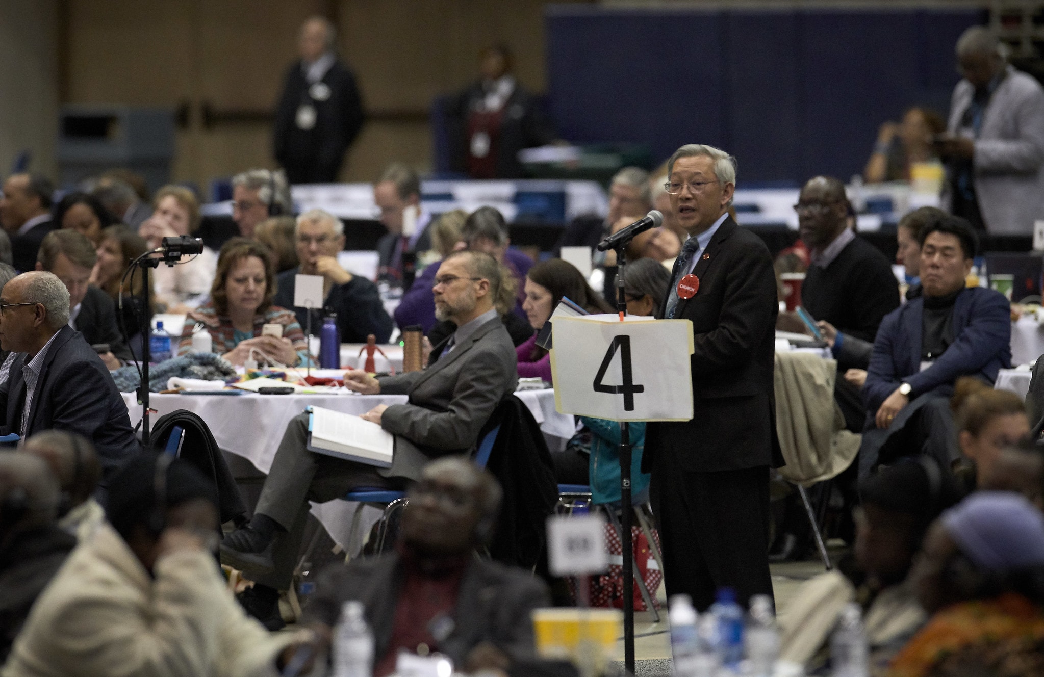 Delegate Jeffrey Kuan of California speaks during the debate on a February 26, 2019, vote to strengthen church policies about homosexuality. The vote came on the last day of a Special Session of the General Conference of The United Methodist Church, held in St. Louis, Missouri. Delegates voted to approve the Traditional Plan, which strengthens penalties for LGBTQIA clergy and prohibits same sex weddings. Kuan unsuccessfully moved to add polygamy and divorce to the list of proscribed activity. Photo by Paul Jeffrey, UMNS.
