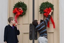 Children hang wreaths on the sanctuary door at Belmont United Methodist Church in Nashville, Tenn., during the church's annual Hanging of the Greens service. Photo by Mike DuBose, United Methodist Communications.