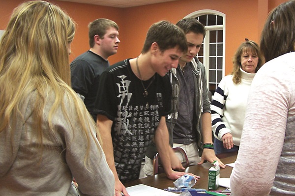 Members of Benton First United Methodist Church 150 boxes and bags of health kit supplies. Photo by Sue Engle. Courtesy of UMNS.