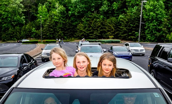 Family attending drive-in worship at Cumming First United Methodist in Cumming, Georgia. Courtesy of Ben Hendren.