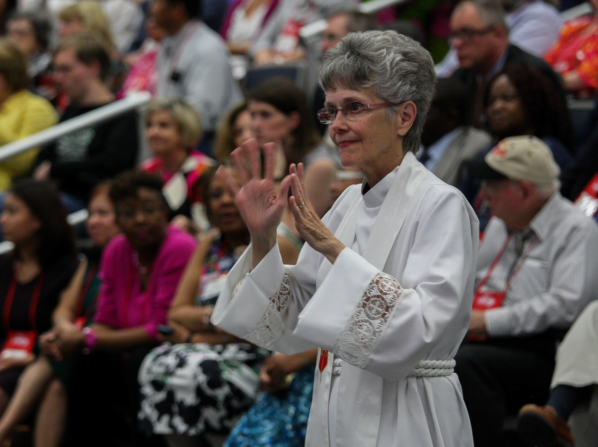 Bishop Peggy Johnson, now president of the Northeastern Jurisdiction College of Bishops, signs a song during the 2016 General Conference. Johnson leads the Philadelphia Area. Photo by Maile Bradfield, UM News.