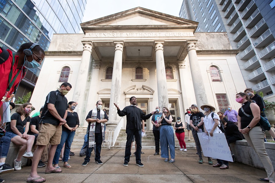 Clergy members gather in prayer during a vigil at McKendree United Methodist Church in Nashville, Tenn., to grieve and remember people lost to acts of racism. Photo by Mike DuBose, UM News.