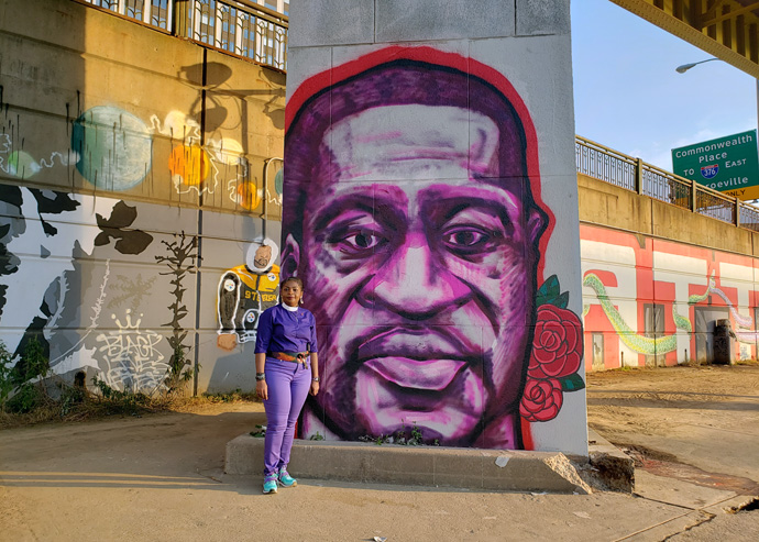 Western Pennsylvania Area Bishop Cynthia Moore-Koikoi stands in front of an image of George Floyd painted on an overpass support in Pittsburgh, Penn. Floyd, a black man, was killed in Minneapolis, Minn., when a white police officer knelt on his neck for nearly 9 minutes. Photo by Jackie Campbell, Western Pennsylvania Conference