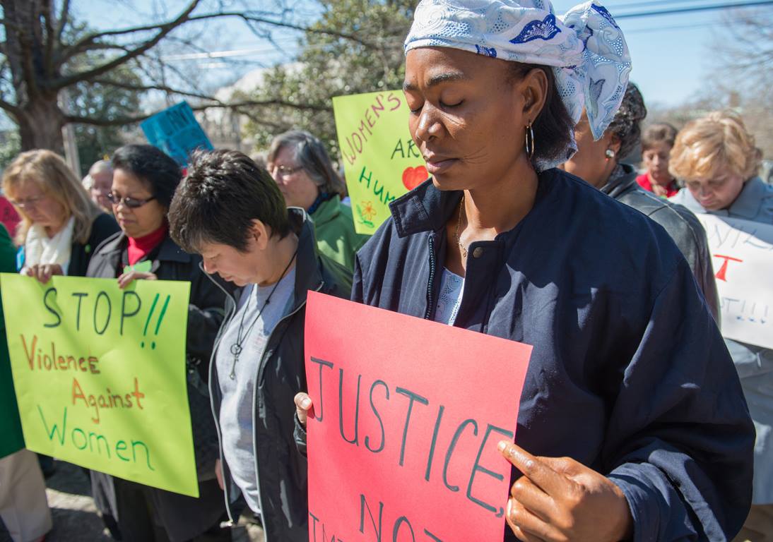 In this 2013 file photo, the Rev. Eunice Musa Iliya (right) participates in an International Women's Day vigil, sponsored by United Methodist Women. Photo by Kristina Krug, courtesy of United Methodist Women.
