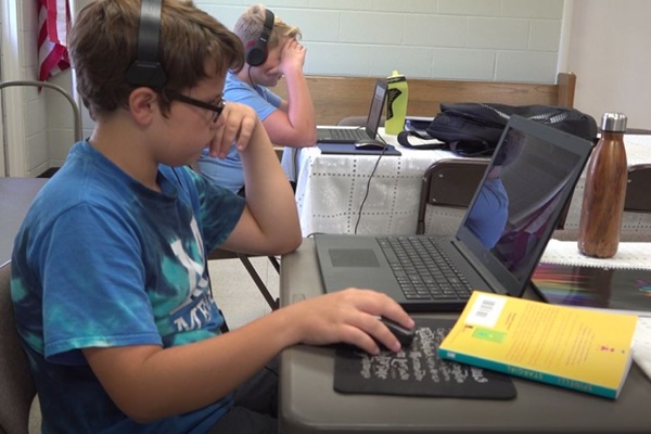Children learning virtually at Denton's Chapel in White's Creek, TN. Courtesy of Lilla Marigza.