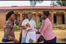 A nurse at Lokolé United Methodist Hospital in Kindu, Congo, returns a child to his mother after a routine immunization session. The United Methodist Church’s hospitals and clinics are helping vaccinate thousands of children each year in the country. Photo by Chadrack Tambwe Londe, UM News.