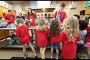 Ben Frey (right, rear) conducts a science experiment for children during vacation Bible school at Connell Memorial United Methodist Church. Photo by Mike DuBose, UM News.