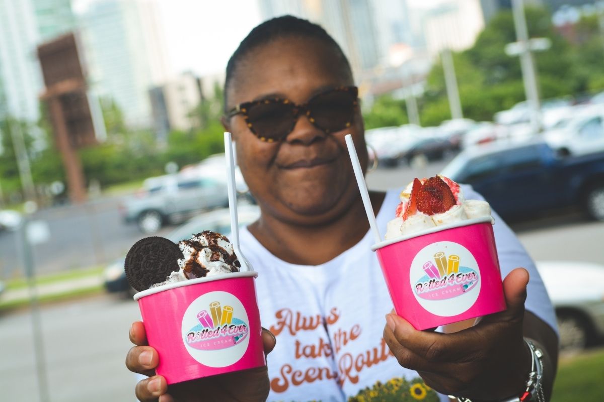 Debra Jemison shows off a couple of the yummy flavors offered by Rolled 4 Ever Ice Cream. (Photo by Aaron Crisler.)