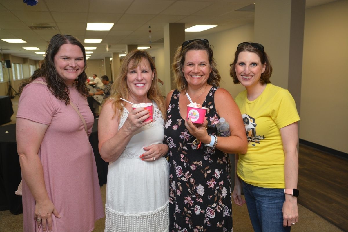 Laura Buchanan,  Diane Degnan, Christy Losee and Brenda Smotherman caught up while cooling down inside following lunch at the picnic. (Photo by Aaron Crisler.)