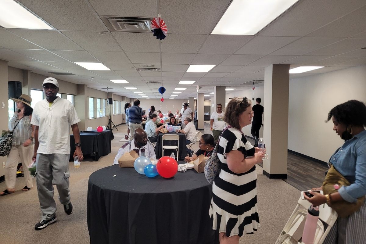 A number of staff gathered inside to eat lunch and chat while escaping the heat of the day. (Photo by Brenda Smotherman.)
