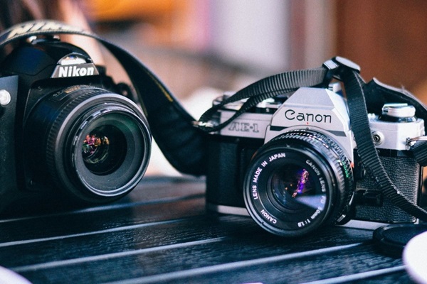 Image of photographer’s equipment by Rosalind Chang on Unsplash.