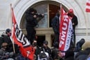 A man breaks a window as supporters of U.S. President Donald Trump storm the U.S. Capitol building in Washington on Jan. 6, 2021. Discipleship Ministries is offering a new Courageous Conversations resource to help United Methodists talk about Christian nationalism in a respectful way. REUTERS/Leah Millis.