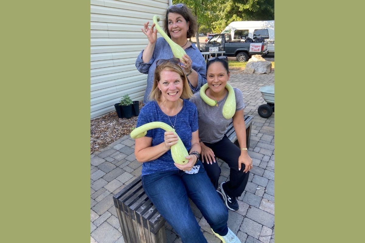 Crystal Caviness, Stacey Hagewood and Lilla Marigza recently spent time in Knoxville getting video and print stories for UMC.org where they were each gifted a Zuccino Rampocante/Italian Trombone squash from the church garden at Concord UMC. The local church annually donates thousands of pounds of produce to the Society of St. Andrew, a United Methodist program which collects surplus produce to be distributed in food pantries and community feeding programs. (Photo provided by Lilla Marigza.)