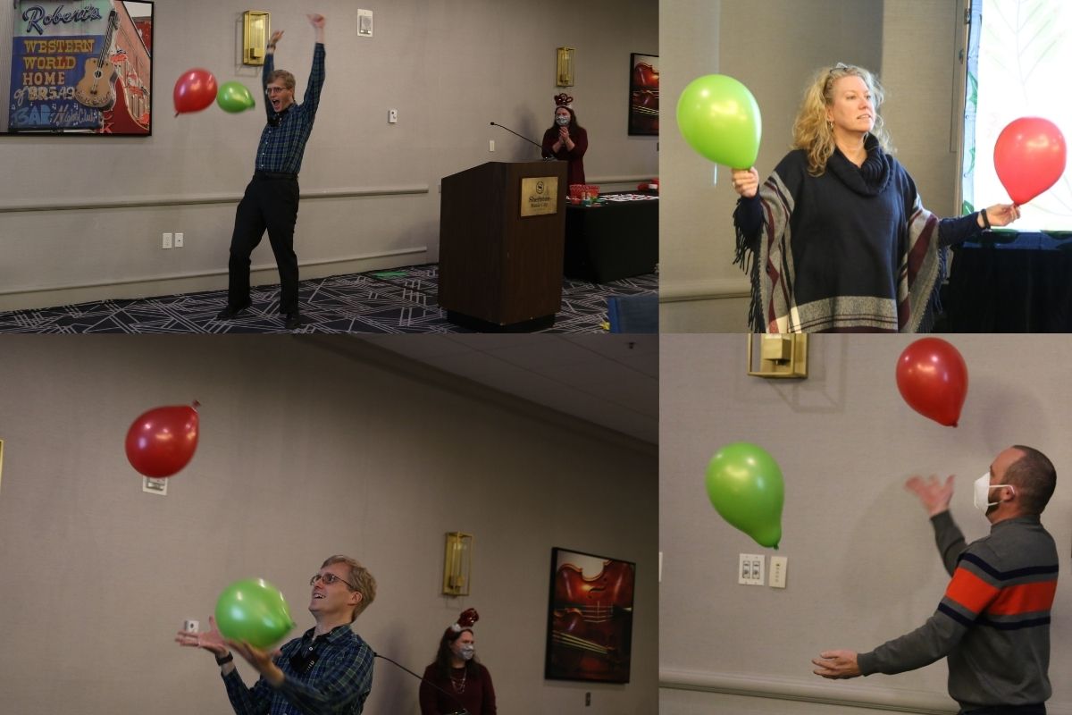 After showing off his balloon juggling skills, Andrew Schleicher (Left) celebrated his game win while Laura Buchanan and other staff cheered him on. Linda Brunner and Craig Catlett also got into the fun. 