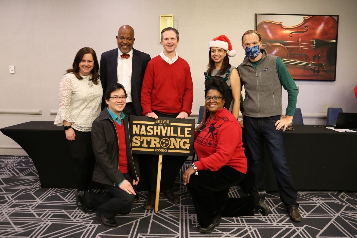  Time was taken during the festivities to celebrate Tim Tanton's return to his home after it was severely damaged by the tornado that hit Nashville in March 2020. United Methodist Communications presented Tim with a Nashville Strong sign to go in front of his home  as a reminder of God's protection and provision.  Pictured on the bottom row L-R: Danny Mai and Helen Allen.  Pictured on the top row L-R:  Jennifer Rodia, Gary Henderson, Tim Tanton, Poonam Patodia and Dan Krause.