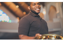 Smiling young adult holding an offering plate. Stock Photo. LeadingIdeas Smiling young adult holding an offering plate. Stock Photo. LeadingIdeas