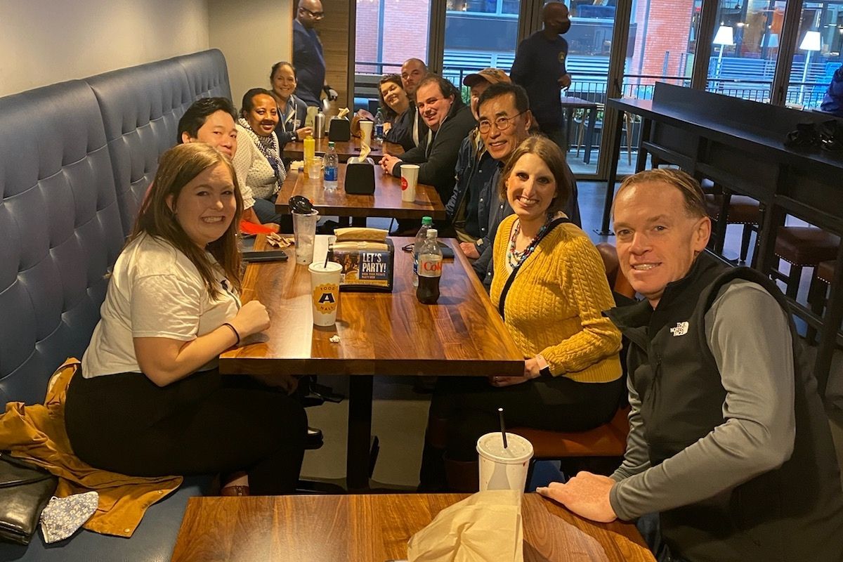 Staff enjoyed a meal and conversation at the Assembly Food Hall. Pictured: Bench row – Ashley Gish, Danny Mai, Elizabeth Peters, Lilla Marigza. Outer row - Dan Krause, Brenda Smotherman, Tom Kim, Tim Tanton, Philip Brooks, Steven Adair, Stacey Hagewood. (Photo by Helen Allen.)
