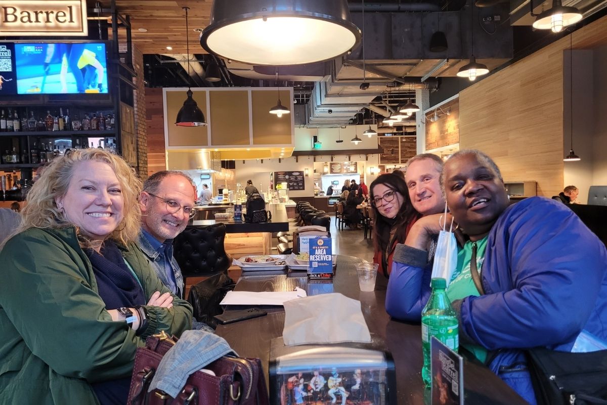 Staff gathered for good food and fellowship at the Assembly Food Hall. Pictured: Left side – Linda Bruner, David Jamieson. Right side – Lladale Carey, Greg Petree, Patty DelliBovi (Photo by Brenda Smotherman.)