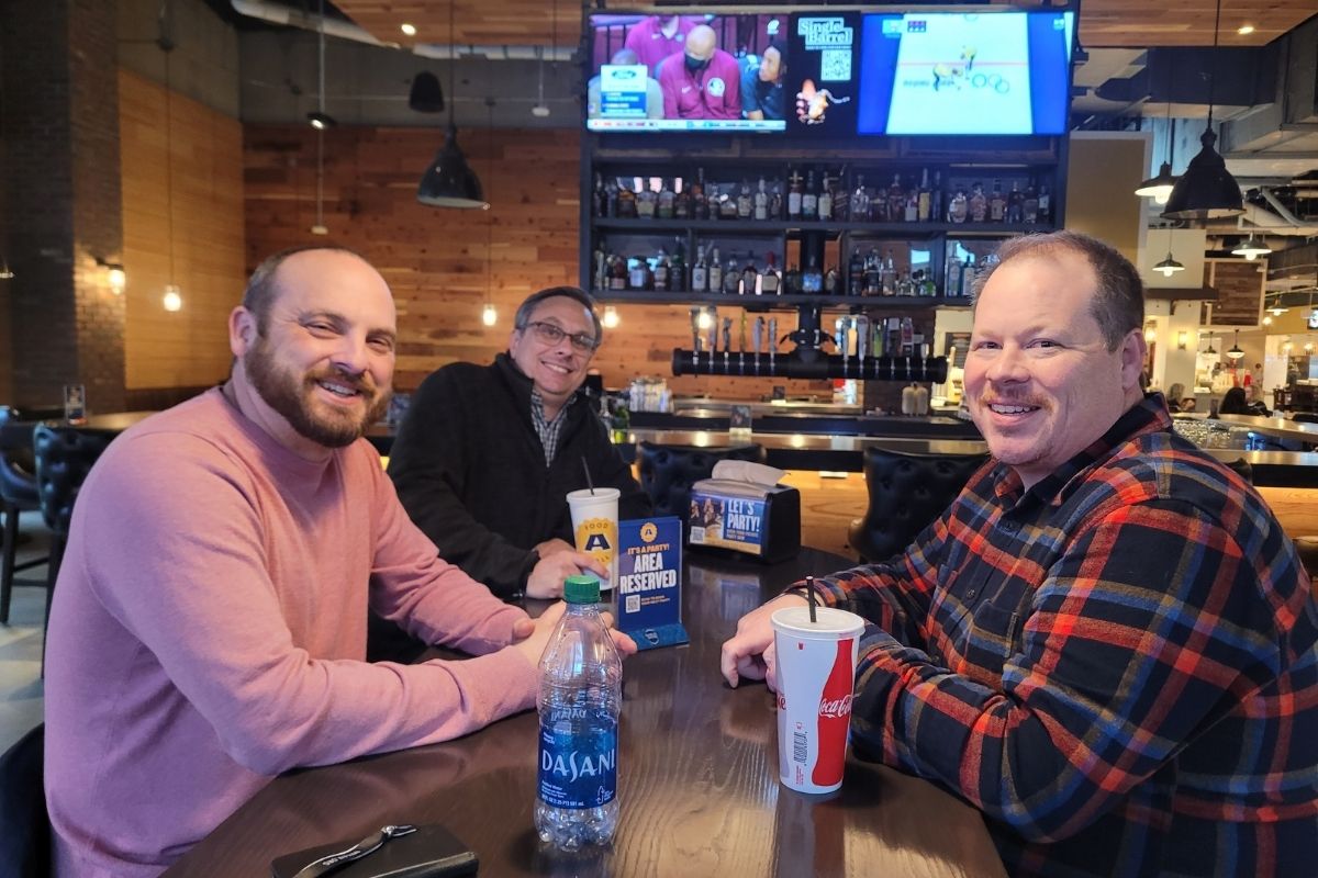 Craig Catlett, John Haney and Josh Mullenix (L-R) enjoyed a meal and conversation at the Assembly Food Hall. (Photo by Brenda Smotherman.)