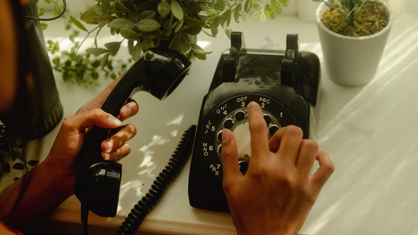 Communications technology has come a long way since the days of the rotary telephone. But even today, the basic phone remains one of the easiest ways for people to connect with one another. Photo by Wesley Hilario courtesy of Unsplash.
