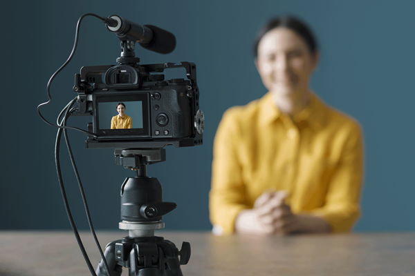 One of the greatest benefits to creating video announcements is the ability to share videos online through Facebook, Twitter and other social media channels. Image by demaerre, iStockphoto.com.