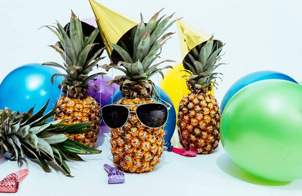 Whether we're in the season of New Year's resolutions or the thick of summer vacation time, you can boost your success by working common cultural events and activities into your messaging. Photo by Pineapple Supply Co. courtesy of Unsplash.