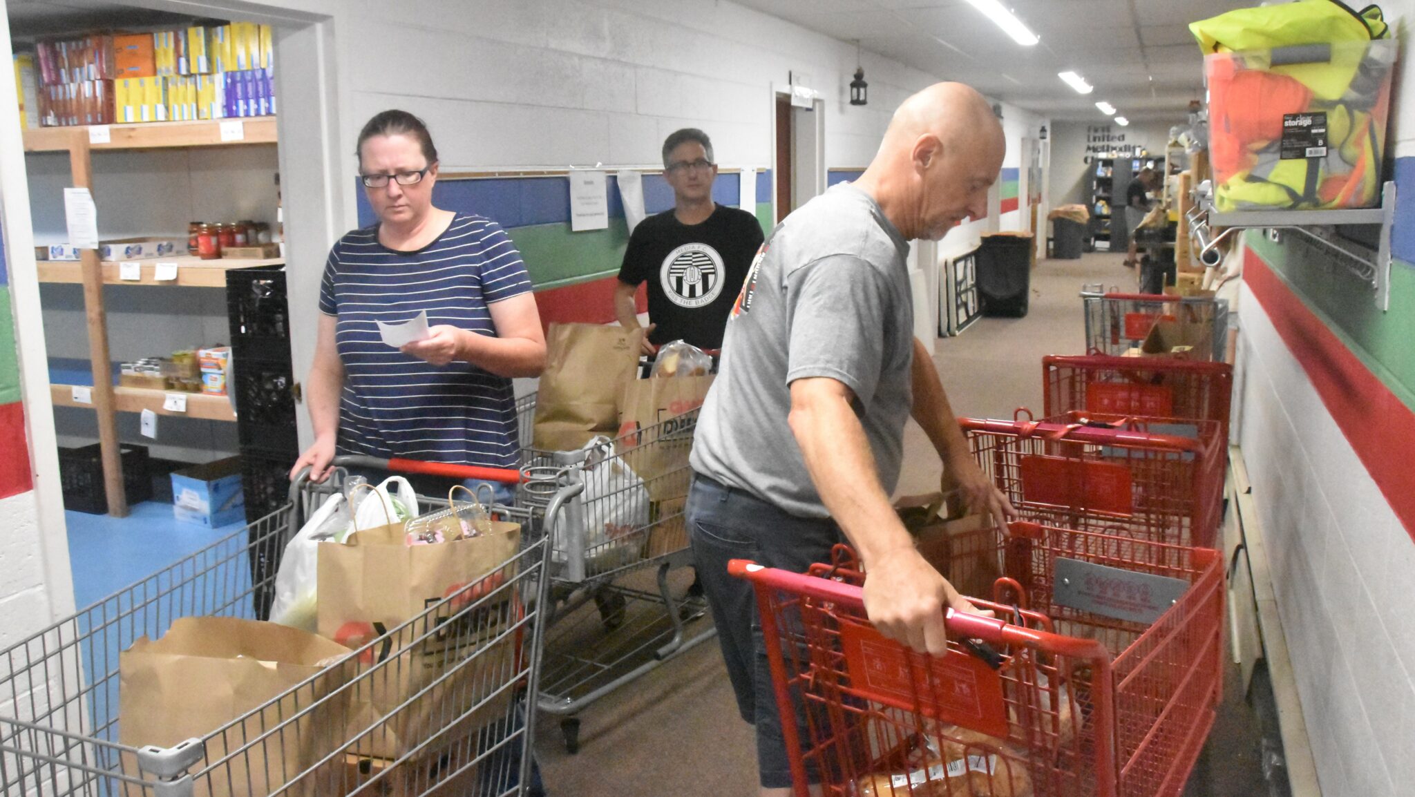 Media Food Bank volunteers prepare to deliver food to neighbors at First UMC. John Coleman photos