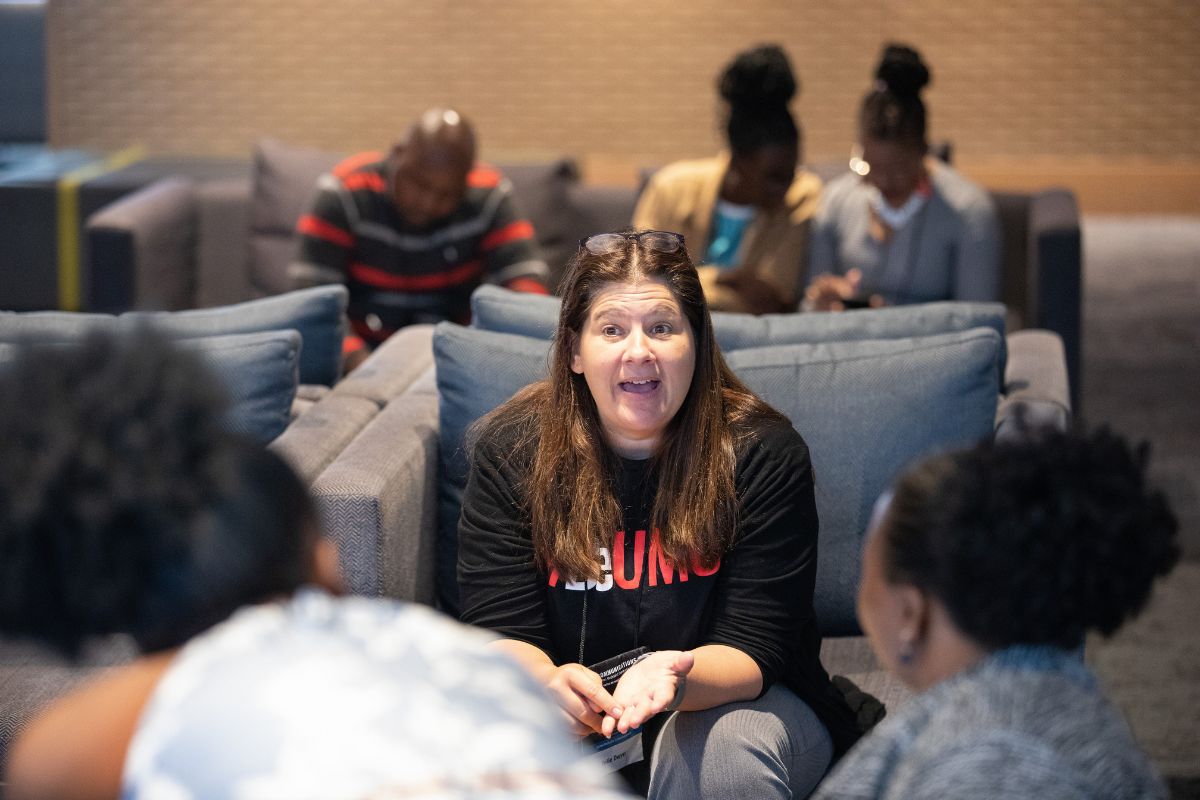 Julie Dwyer, editor of UM News, speaks with trainees in South Africa. (Photo courtesy of United Methodist Communications.)