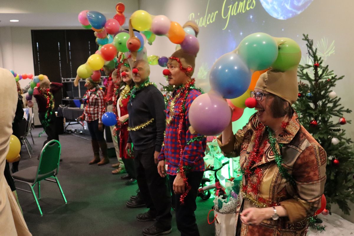 Staff shared off their party game teams' creativity during the Reindeer Games activity. 