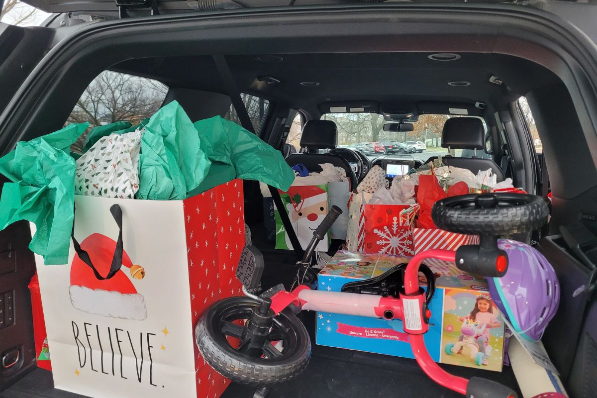 Gifts being loaded into the transport vehicle to be delivered to the foster ambassador. (Photo by Brenda Smotherman, United Methodist Communications.)