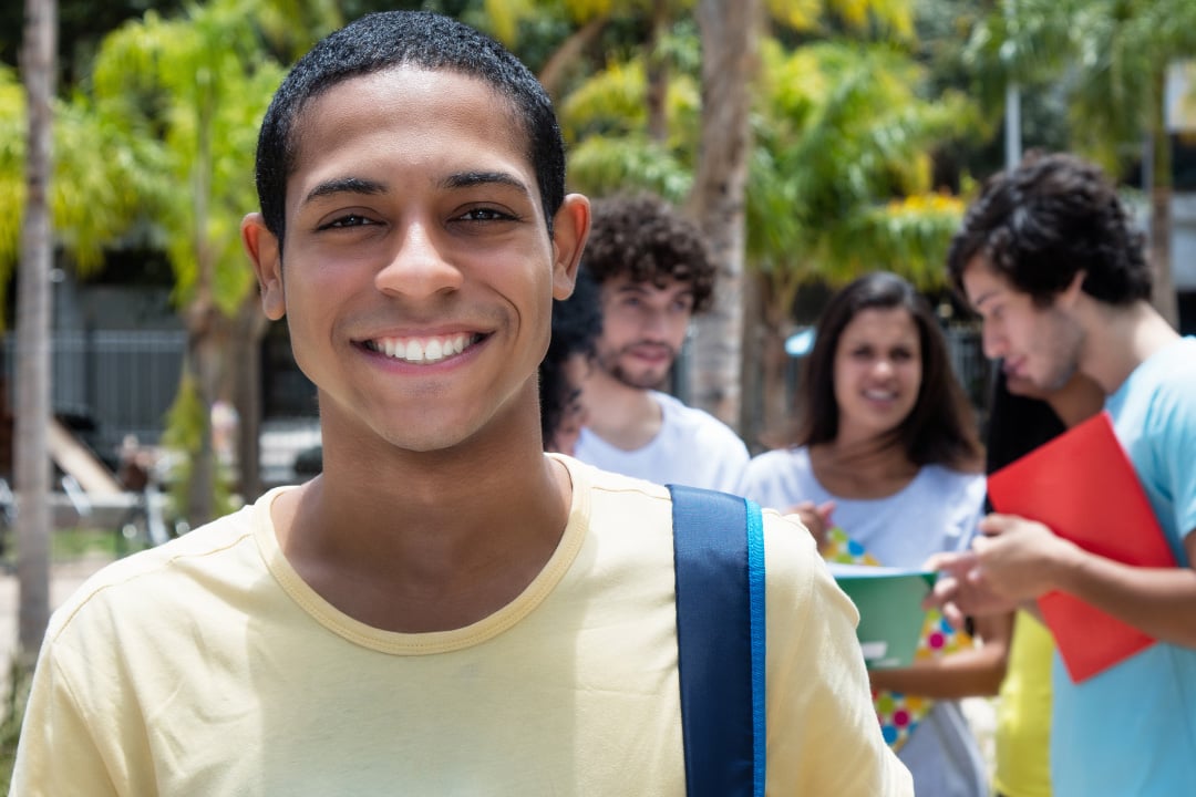 GBHEM offers scholarships to United Methodist Students pursuing undergraduate and graduate degrees. Image of male student student and other students in the background. Image courtesy of the General Board of Higher Education and Ministry.