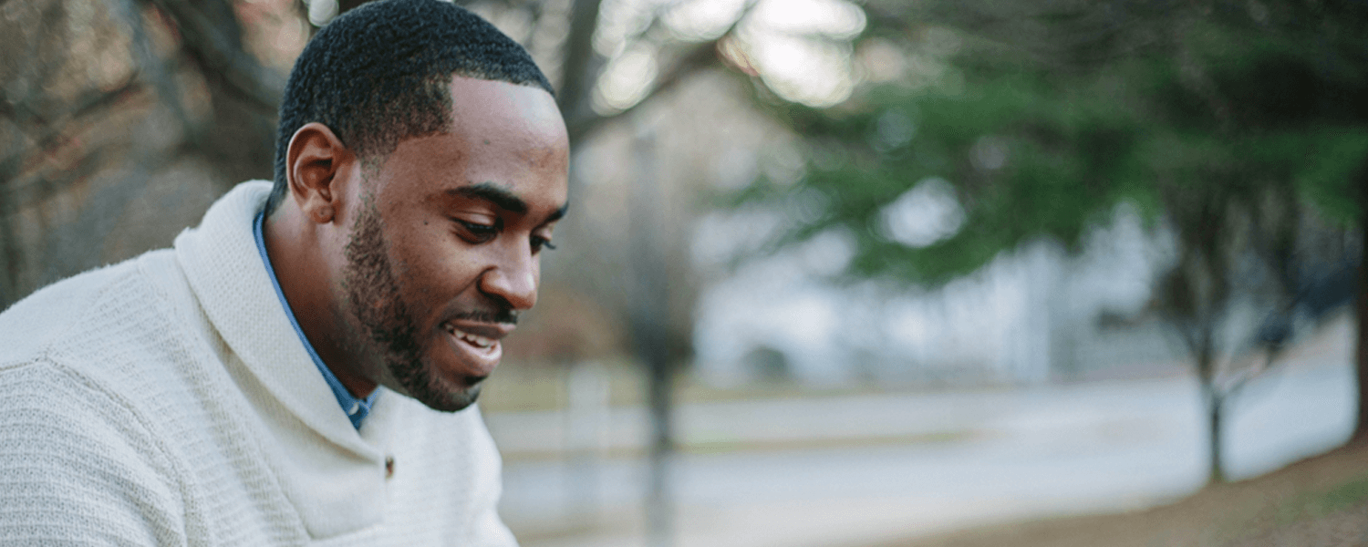 World Communion Sunday calls the church to reach out to all people and model diversity among God’s children. Image of young Black man reading outside by Tamarcus Brown, Unsplash.com.