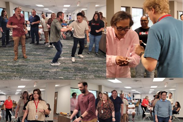 Staff compute to be the fastest at the spoon race.