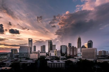 Charlotte, NC skyline at sunset. Photo by Daniel Weiss, Unsplash.com.