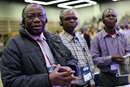 Vagris Umba (from left), Bertin Kyungu and Adolphe Kitenge, delegates from the North Katanga Conference in Congo, listen to the morning worship at the 2016 United Methodist General Conference at the Portland Convention Center in Portland, Ore. The proposed regionalization legislation coming to General Conference on April 23-May 3 is generating a lot of discussion among African United Methodists. Their votes could be key to whether regionalization can pass. File photo by Kathleen Barry, UM News.