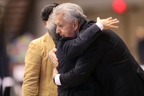 Bishop Hee-Soo Jung embraces Bishop Ruben Saenz Jr. during the prayer time before Communion. The 2019 Special Session of the United Methodist General Conference in St. Louis designated Saturday, Feb. 23, as a day of prayer. Photo by Kathleen Barry, UMNS.