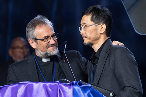 Bishop Harald Rückert (left) of Germany puts his arm around Bishop Eduard Khegay after delegates to the United Methodist General Conference in Charlotte, N.C., voted on April 25 to allow the four conferences that Khegay oversees in the Eurasia Episcopal Area to leave the denomination. Photo by Mike DuBose, UM News.